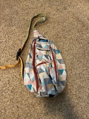 Kavu Geo Triangle Sling Bag in Cream, Teal, Peach and Navy
